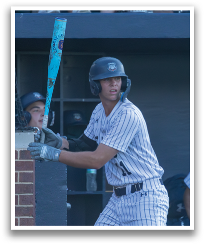 A baseball player in a striped uniform is holding a bat, preparing to swing. Contenido generado con IA