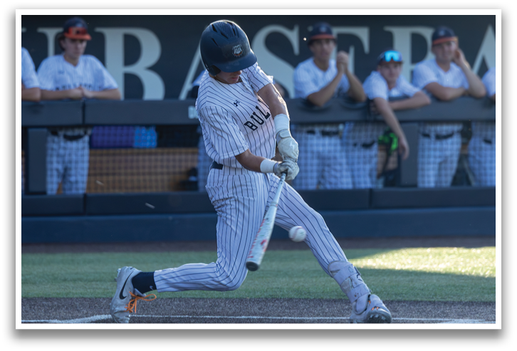 A baseball player is swinging a bat at a ball. Contenido generado con IA