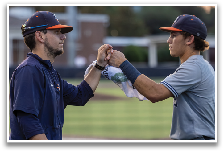 A group of baseball players are standing on a field, some of them wearing baseball gloves. Contenido generado con IA
