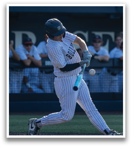 A baseball player is swinging a bat, attempting to hit a ball. Contenido generado con IA
