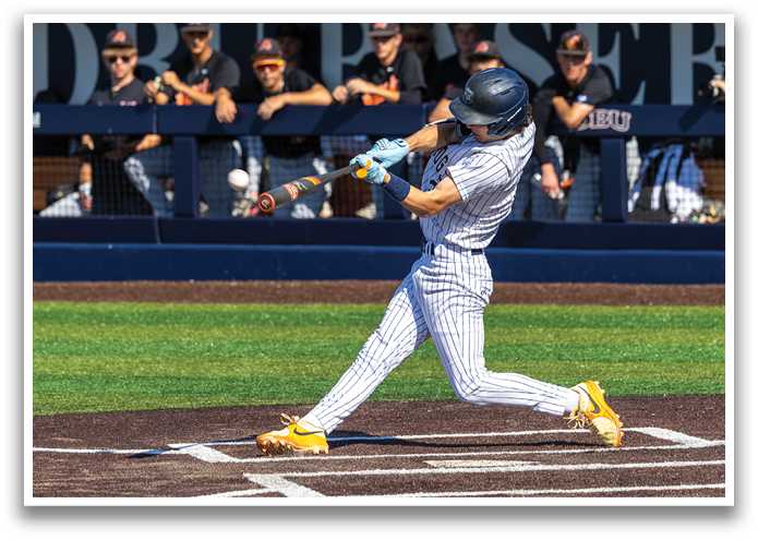 A baseball player in a blue helmet and white uniform is swinging a bat at a ball. Contenido generado con IA
