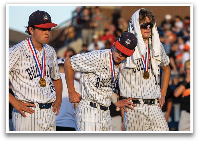 Three baseball players wearing uniforms and gold medals. Contenido generado con IA