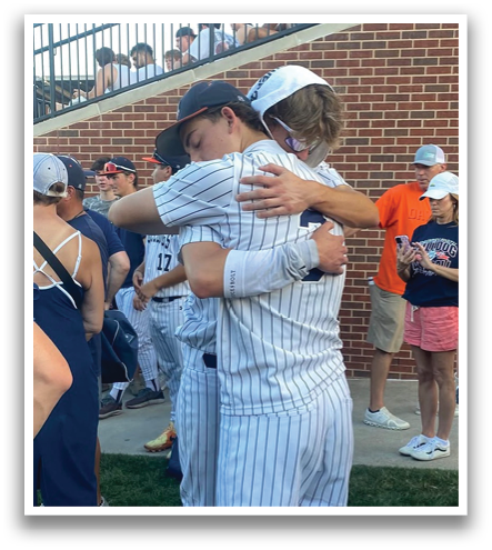 Two baseball players hugging each other on the field. Contenido generado con IA