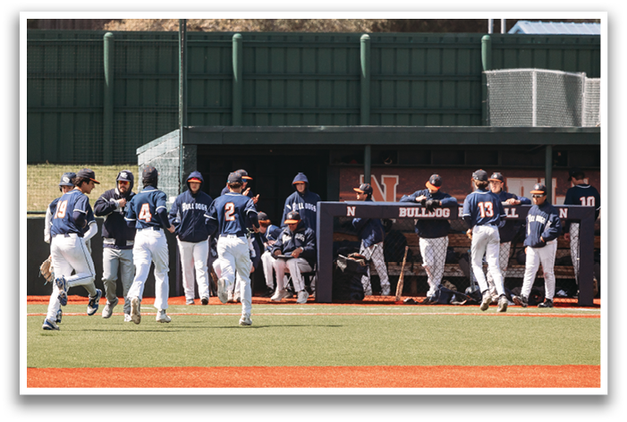 Baseball players in blue uniforms are standing on a field. Contenido generado con IA