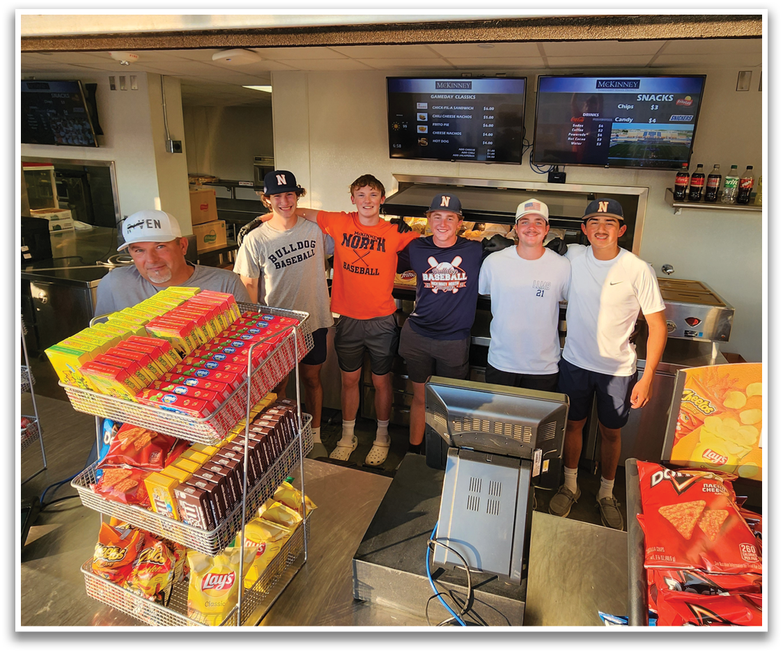 A group of young men pose for a photo in a cafeteria. Contenido generado con IA