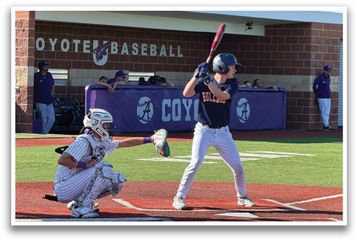 A baseball player is at bat, holding a bat and preparing to swing. Contenido generado con IA
