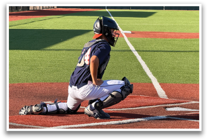 A baseball player is kneeling on the field, wearing a helmet and catcher's gear. Contenido generado con IA