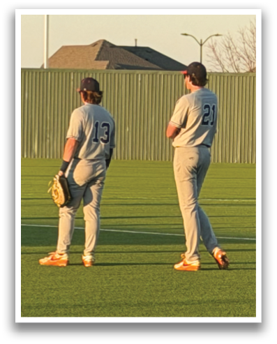 Two baseball players standing on a field, one wearing the number 25. Contenido generado con IA