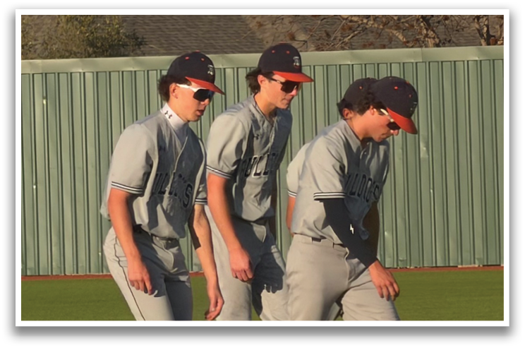 Three baseball players wearing grey uniforms and red hats are walking on a field. Contenido generado con IA