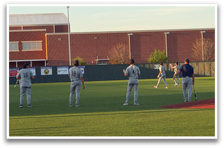 A group of baseball players are standing on a field, some of them holding baseball bats. Contenido generado con IA