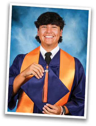 A young man wearing a blue graduation gown and orange sash is smiling for the camera. Contenido generado con IA