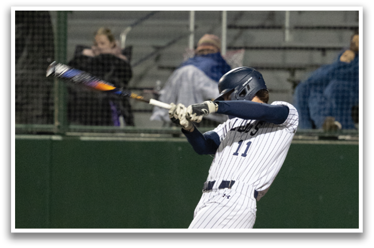 A baseball player is swinging a bat at a ball. Contenido generado con IA