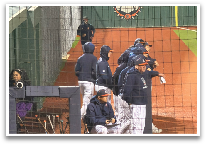 Baseball players sitting on the ground in the dugout. Contenido generado con IA