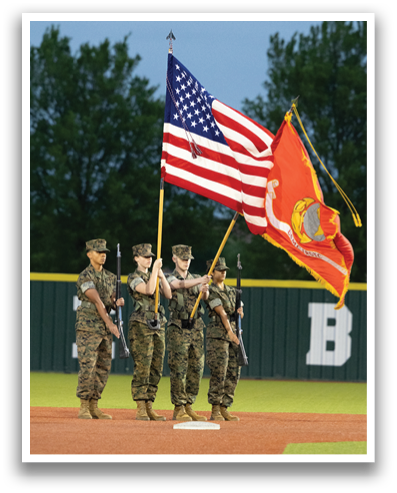 Three military men in camouflage uniforms are holding flags. Contenido generado con IA