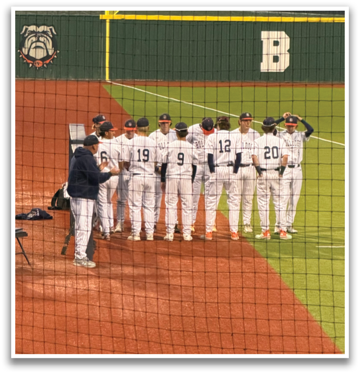 Baseball players standing on a field, some wearing helmets. Contenido generado con IA