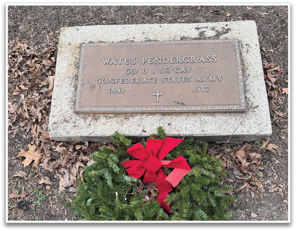 A grave marker with a red bow on it. Contenido generado con IA