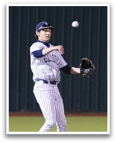 A baseball player is swinging a bat at a ball on a field. Contenido generado con IA