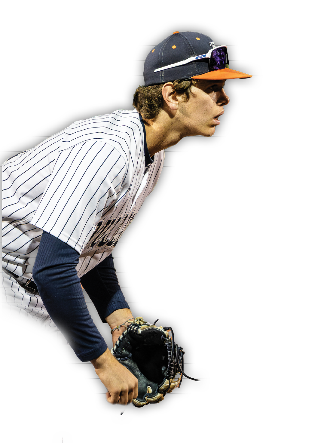 A baseball player wearing a blue and white uniform, holding a catcher's mitt, and looking down. Contenido generado con IA