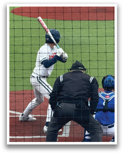 A baseball player is swinging a bat at a ball during a game. Contenido generado con IA
