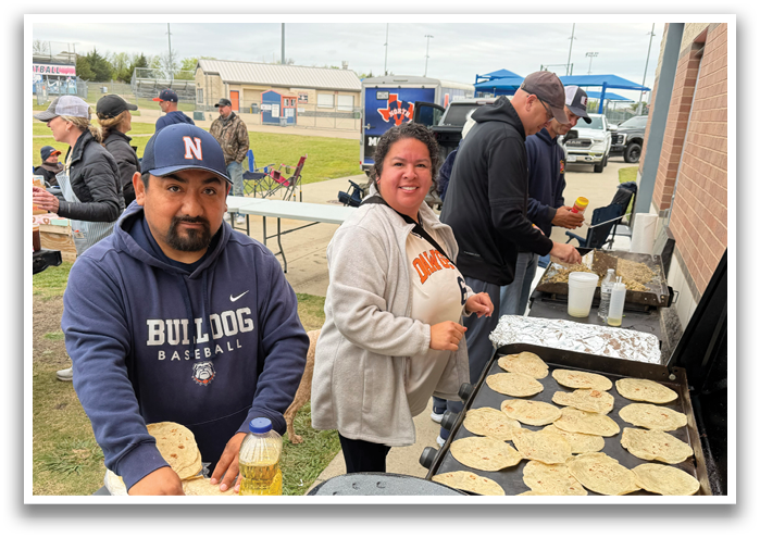 A man and a woman are preparing food on a grill. Contenido generado con IA