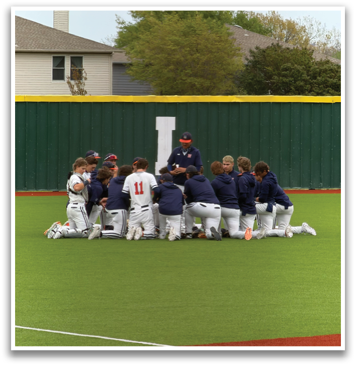 A group of baseball players are sitting on the ground in the grass. Contenido generado con IA