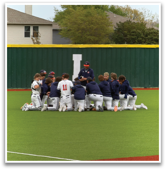 A group of baseball players are sitting on the ground in the grass. Contenido generado con IA