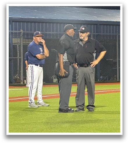 Two men in baseball uniforms are standing on a field, talking to each other. Contenido generado con IA