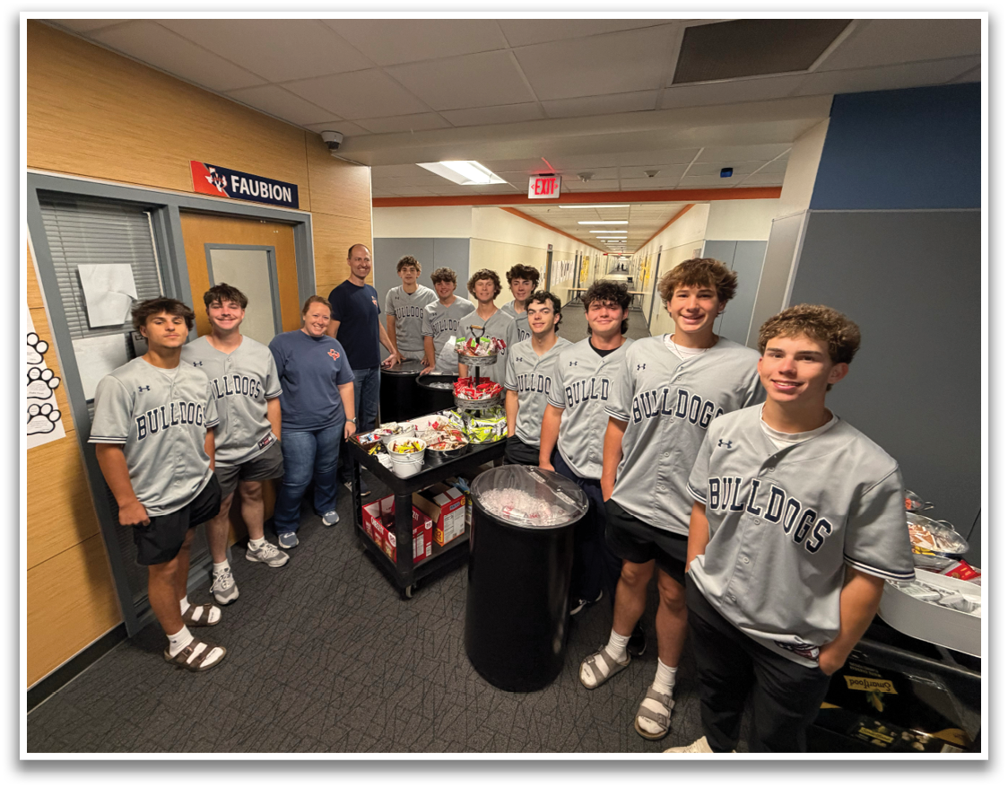 A group of young men wearing grey jerseys pose for a picture in a room. Contenido generado con IA