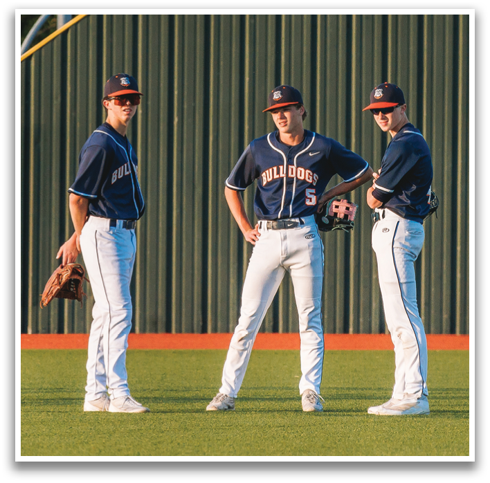 Three baseball players standing on a field, wearing blue uniforms and white shoes. Contenido generado con IA