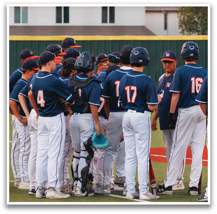 A group of baseball players wearing blue uniforms are standing on a field. Contenido generado con IA