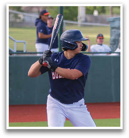 A baseball player in a blue and red uniform is holding a bat and preparing to swing at a pitch. Contenido generado con IA