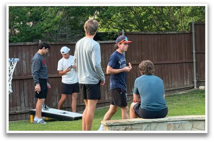 A group of young men are playing a game of basketball in a backyard. Contenido generado con IA