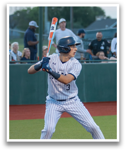 A baseball player is at bat, holding a bat and preparing to swing. Contenido generado con IA