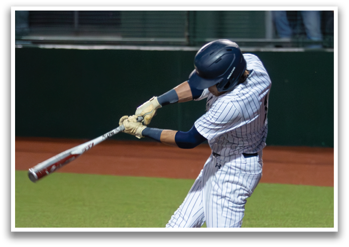 A baseball player is swinging a bat at a ball during a game. Contenido generado con IA