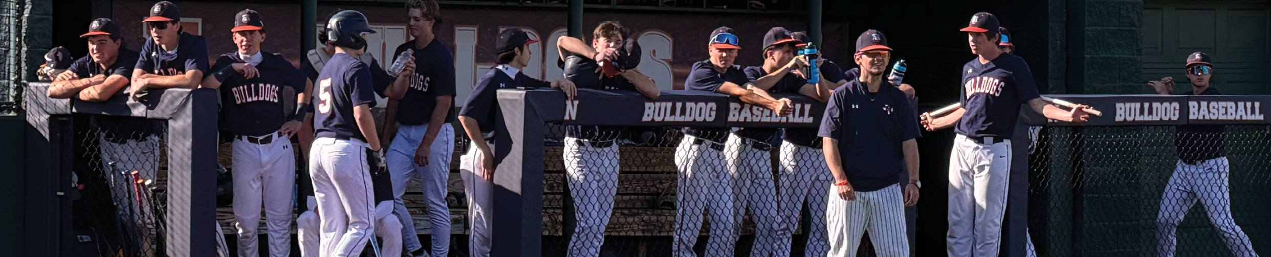 A group of baseball players are standing on a baseball field. Contenido generado con IA