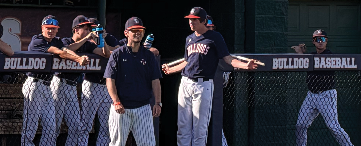A group of baseball players are standing on a baseball field. Contenido generado con IA