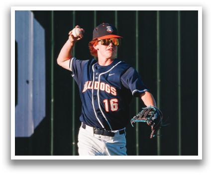 A baseball player wearing a blue and white uniform is running on the field. Contenido generado con IA