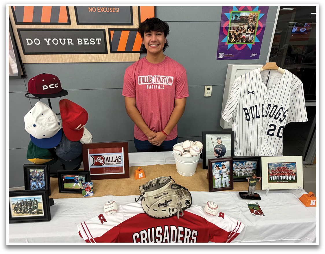 A man is standing in front of a table with a baseball jersey on it. Contenido generado con IA