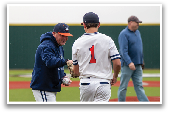 Two men are standing on a baseball field, one of them is holding a baseball glove. Contenido generado con IA