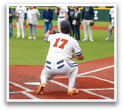 A baseball player in a white uniform with the number 17 on the back is kneeling on the field. Contenido generado con IA