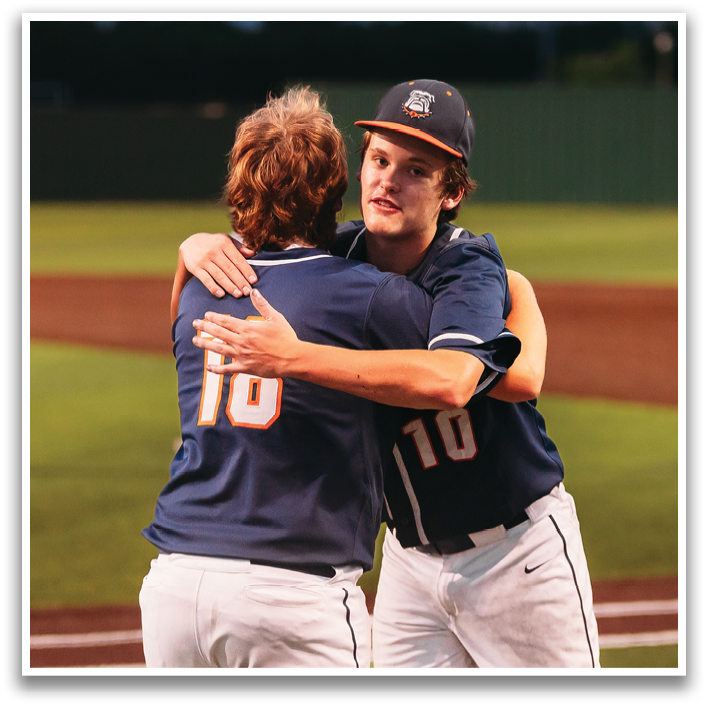 Two baseball players hugging each other on the field. Contenido generado con IA