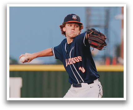 A baseball player in a blue uniform is on the mound, preparing to throw the ball. Contenido generado con IA