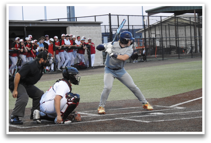 A baseball player is swinging a bat at a ball during a game. Contenido generado con IA