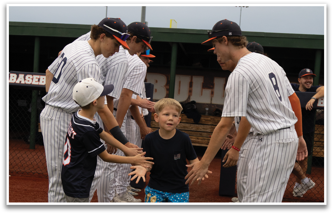 A group of baseball players shake hands with a young boy. Contenido generado con IA