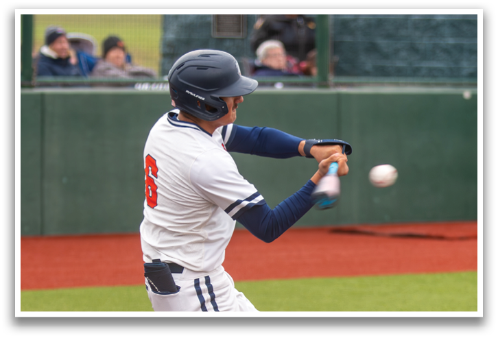 A baseball player is swinging a bat at a ball. Contenido generado con IA