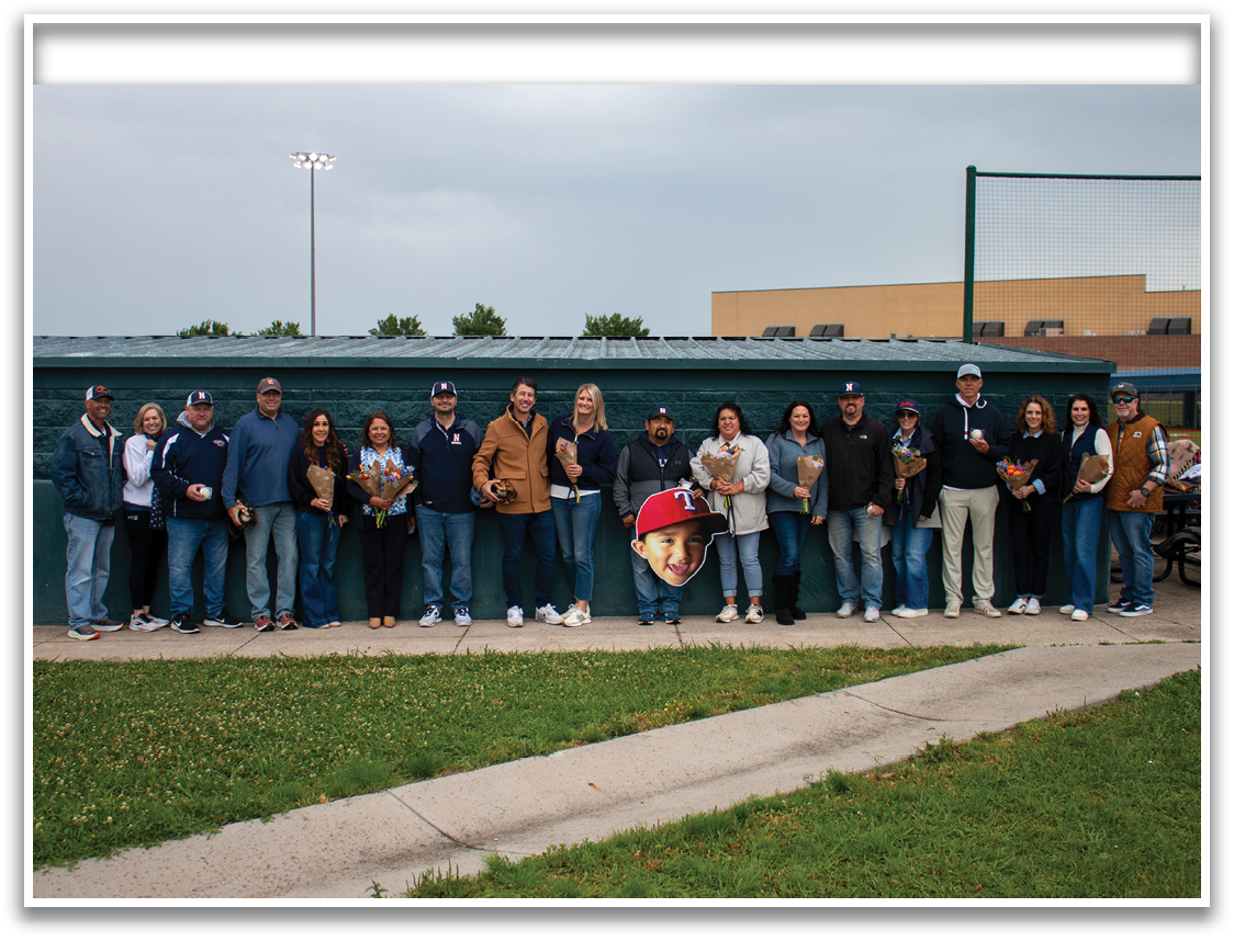 A group of people are standing in front of a baseball dugout, holding flowers. Contenido generado con IA