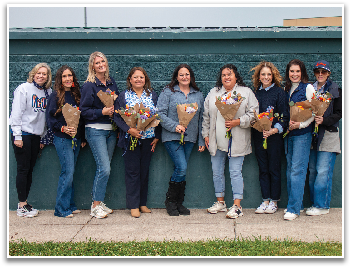 A group of women are standing together, holding flowers. Contenido generado con IA