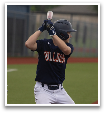 A baseball player in a blue shirt and white pants is swinging a bat, attempting to hit a ball. Contenido generado con IA