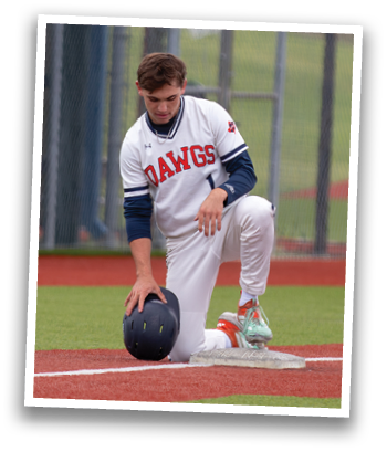 A baseball player bends over to pick up a ball on the field. Contenido generado con IA