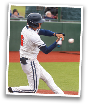 A baseball player is swinging his bat at a ball. Contenido generado con IA